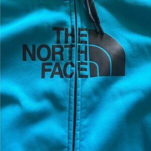 The North Face Turquoise Jacket with Black Logo
